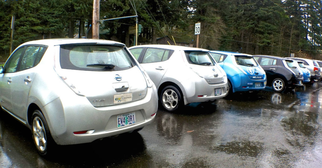 A line of Nissan Leaf electric vehicles